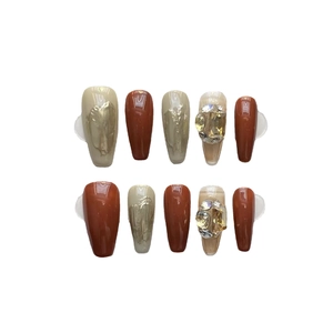 Handmade press-on nails set in caramel and beige with glitter rhinestones and gold leaf