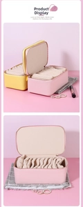 Macro view of portable jewelry boxes with litchi grain leather and accordion interior