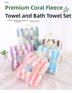 Macro shot of striped coral fleece towel set in pastel pink, blue, and purple colors