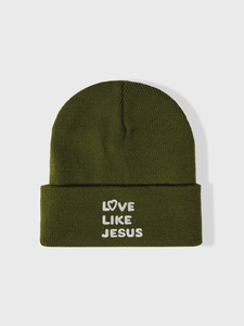 Detail of white Love Like Jesus embroidery on olive green knitted beanie cuff