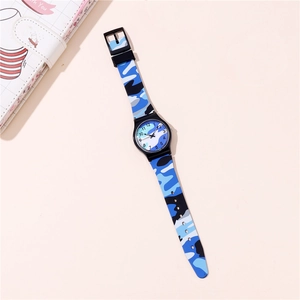 Close-up of kids' camouflage silicone watch with blue pattern on a pink background