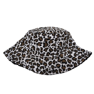 Detail of trendy leopard print bucket hat with high-quality woven canvas fabric texture