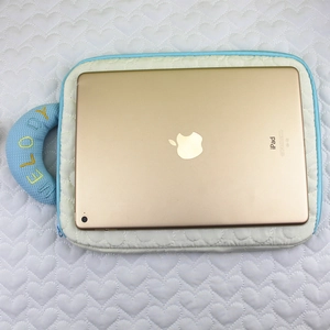 Quilted heart pattern iPad sleeve with blue handle and Melody embroidery detail