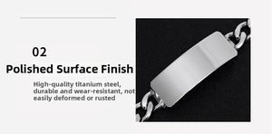 Close-up of polished stainless steel Cuban link bracelet with rectangle metal plate