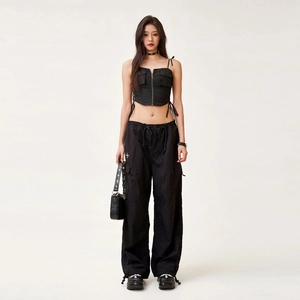 Women's black utility cargo outfit with cropped vest and matching wide-leg pants
