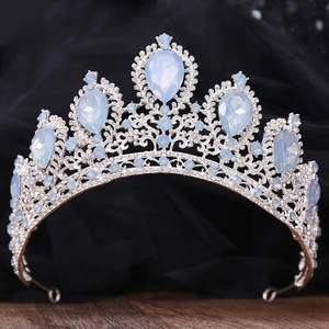 Detailed close-up of a silver Baroque bridal crown with blue rhinestones and crystals