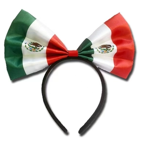 Detailed view of Mexico flag headband with large satin bow and national emblem print