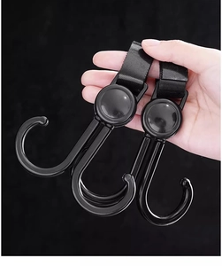 Detail of 360-degree rotating dual hooks with adjustable nylon velcro straps in black