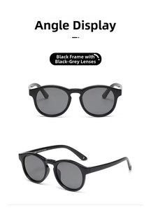 Detail view of round black silicone sunglasses with polarized grey lenses for babies
