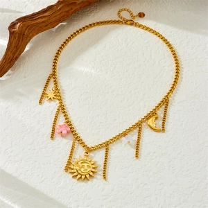 Gold plated stainless steel necklace with sun moon star pendants and pink flower tassels