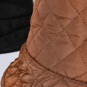 Quilted caramel brown puffer bucket hat with elegant diamond stitching and satin finish