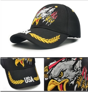 Close-up of eagle embroidery and USA text on black baseball cap with laurel wreath