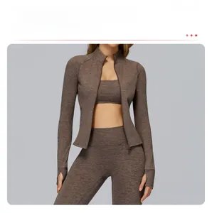 Detail of zip-up sports jacket with functional thumbholes and stand-up collar design