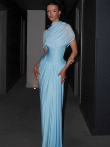 Elegant light blue halter neck evening gown with ruched waist and floor-length silhouette