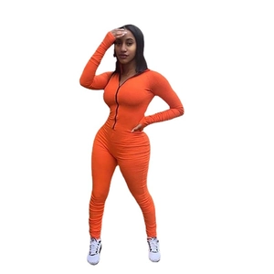 Slim fit orange long sleeve jumpsuit for women with front zipper closure and stretch fabric