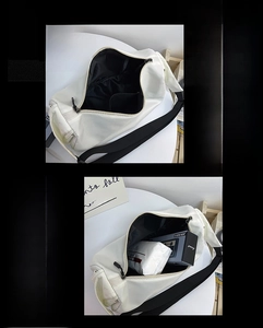 Detail view of large white cylinder fitness bag showing internal storage capacity