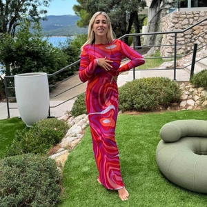 Detailed close-up of slim fit maxi dress with red and purple swirl pattern print