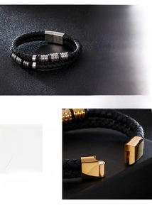 Macro shot of men's braided leather bracelet with magnetic clasp and engraved metal beads