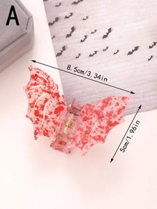 Detailed view of red marbled bat hair claw clip with dimensions 8.5cm x 5cm