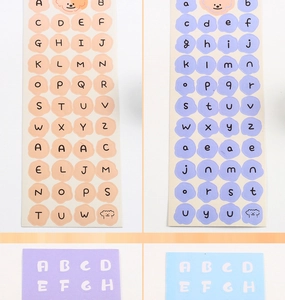 Detail of colorful alphabet stickers for DIY scrapbooking in pink, purple, and blue tones