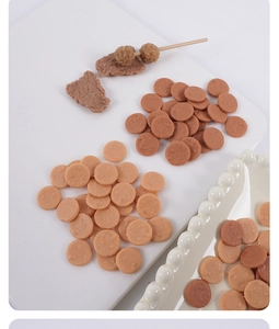 Detailed view of miniature realistic beef and chicken patties for dollhouse DIY food play