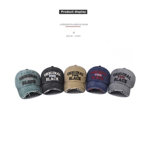 Detailed view of five vintage washed cotton baseball caps with distressed brims and embroidery