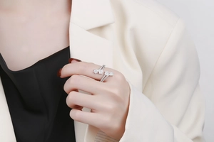 Close-up of double-layered star ring with pavé-set zircon on model's finger