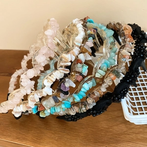 Close-up of bohemian acrylic headbands with colorful crushed stones and beads decoration