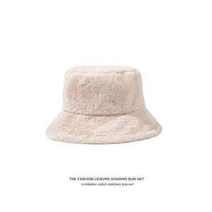 Macro detail of plush beige faux rabbit fur bucket hat showing soft fluffy texture