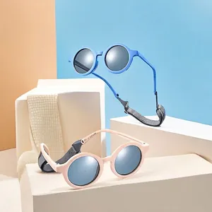 Polarized soft silicone baby sunglasses in blue and pink with adjustable head straps
