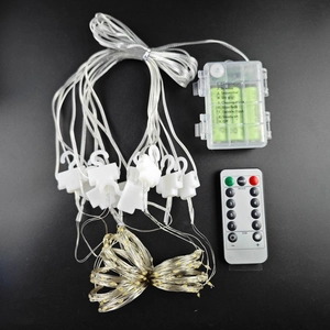 Detail view of LED copper wire curtain lights with battery box and remote control