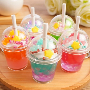 Set of 5 colorful miniature bear ice cream and bubble tea keychains on a wooden tray