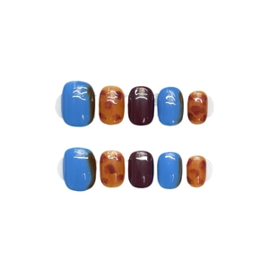 Japanese leopard print amber press-on nails set with blue and orange glossy finish