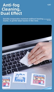Detail of disposable anti-fog lens wipe being used to clean a laptop keyboard surface