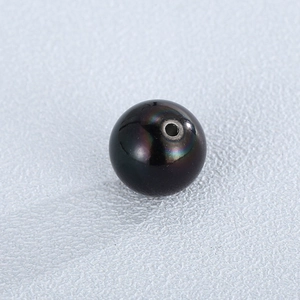 Perle en acier noir 12mm avec reflets arc-en-ciel et trou central pour la création
