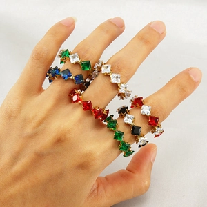 Adjustable gold titanium ring set with colorful square-cut zircon stones on a hand