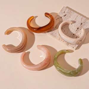 Retro colorful geometric acrylic open cuff bracelets in translucent amber and cream