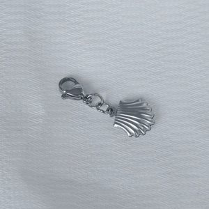 Detail of a hollow starfish shell pendant made of stainless steel with a lobster clasp