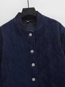 Quilted dark blue denim jacket with silver buttons and rib-knit stand collar detail
