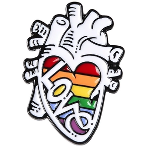 Detailed view of an anatomical heart pin with rainbow colors and LOVE engraving