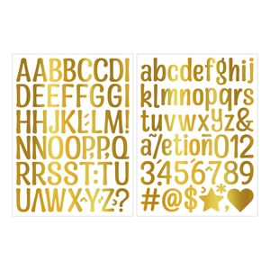 Macro view of metallic gold alphabet and number stickers for DIY gifts and bottle decor