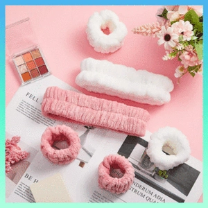 Flat lay of pink and white coral fleece bow headbands with matching scrunchies set