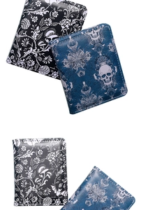 Close-up of blue skull and floral print on compact zippered wallet for men and women