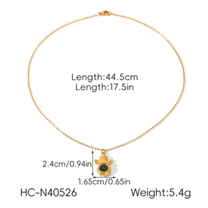 Detail view of gold stainless steel necklace with green zircon pendant and size specs
