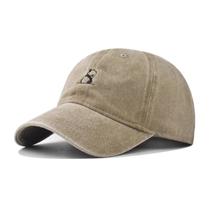 Close-up of black panda embroidery on khaki washed cotton vintage baseball cap
