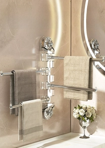 Close-up of swivel towel rack with multi-bar acrylic design and dual suction cups