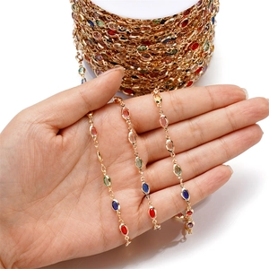Detailed view of colorful oval crystal gemstone gold chain for DIY jewelry making