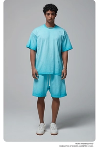 Detail of lake blue retro short sleeve t-shirt and drawstring shorts with textured fabric