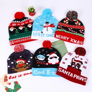 Colorful LED knitted Christmas hats with assorted festive patterns and Merry Xmas slogans