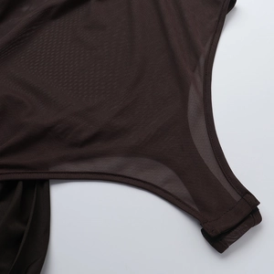 Detail of dark brown mesh bodysuit featuring adjustable triple hook-and-eye bottom closure